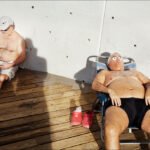 Middle Aged Men Relaxing on Sunny Deck Older men relaxing on sunny wooden deck near beach, sunbathing and reading.